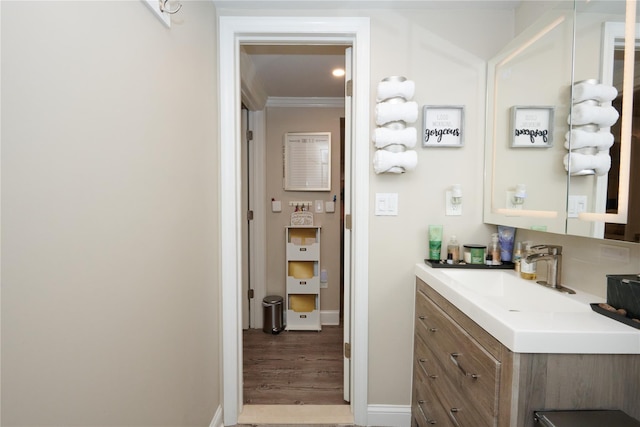 112 N Columbus Ave, Mount Vernon, NY 10553 - bathroom featuring vanity, wood finished floors, and ornamental molding