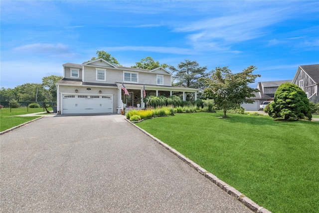 40 Spray Ct, Bayport, NY 11705 - view of front of property with asphalt driveway, an attached garage, and a porch