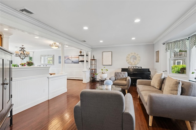 40 Spray Ct, Bayport, NY 11705 - living area featuring ornate columns, ornamental molding, wainscoting, dark wood finished floors, and a baseboard radiator