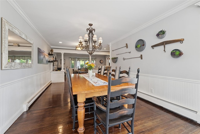 40 Spray Ct, Bayport, NY 11705 - dining space with a baseboard radiator, baseboard heating, wood-type flooring, a chandelier, and wainscoting