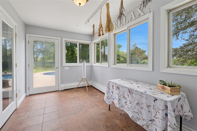 40 Spray Ct, Bayport, NY 11705 - unfurnished sunroom featuring plenty of natural light and baseboard heating