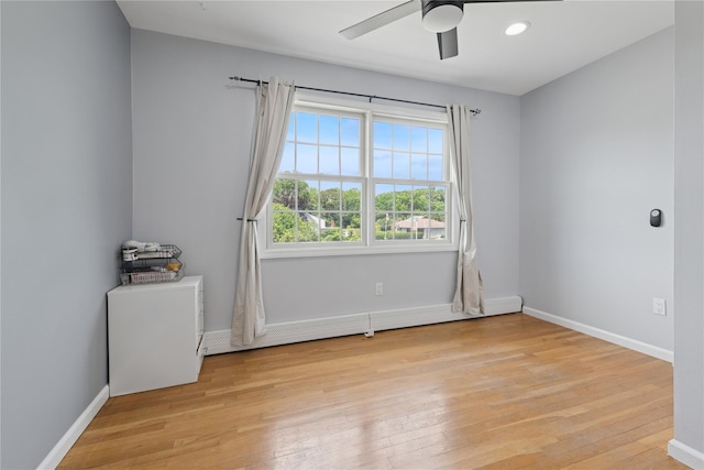 40 Spray Ct, Bayport, NY 11705 - empty room featuring a ceiling fan and light wood finished floors