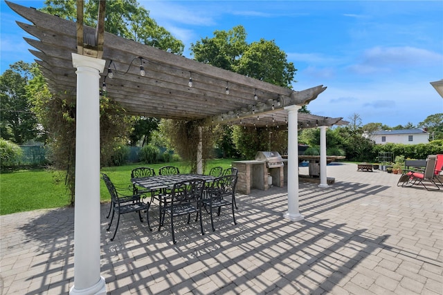 40 Spray Ct, Bayport, NY 11705 - view of patio featuring a pergola, outdoor dining area, exterior kitchen, and a fire pit