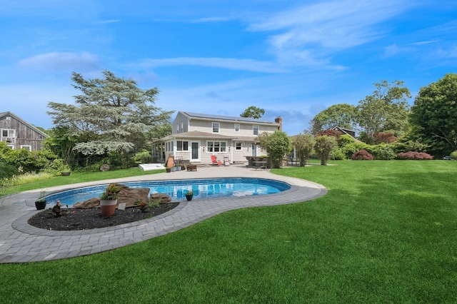 40 Spray Ct, Bayport, NY 11705 - back of property with an outdoor pool, a lawn, and a patio area
