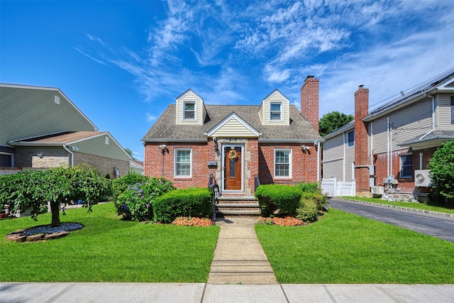 31 Pilgrim St, New Hyde Park, NY 11040 - cape cod-style house with brick siding, roof with shingles, and a chimney
