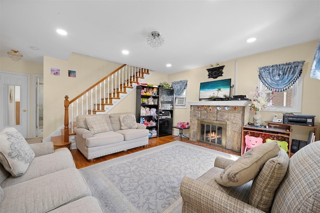 31 Pilgrim St, New Hyde Park, NY 11040 - living area featuring stairs, wood finished floors, recessed lighting, and a fireplace