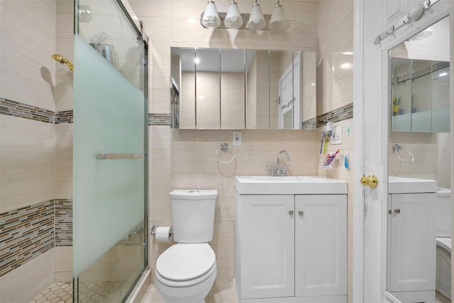 31 Pilgrim St, New Hyde Park, NY 11040 - bathroom with tile walls, vanity, and a shower stall