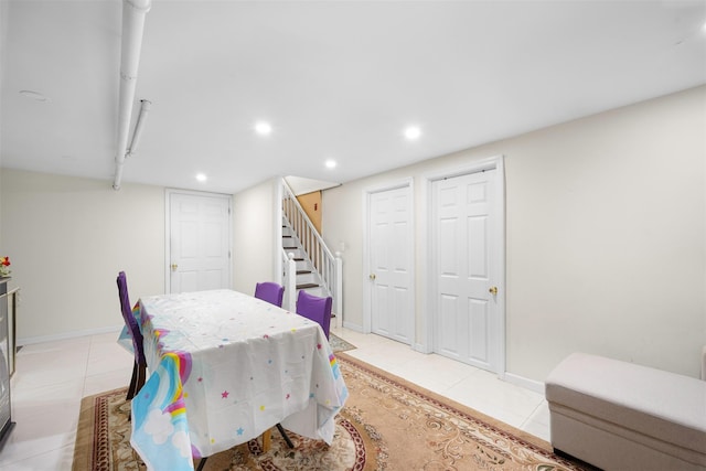 31 Pilgrim St, New Hyde Park, NY 11040 - dining room featuring light tile patterned floors, recessed lighting, and stairway
