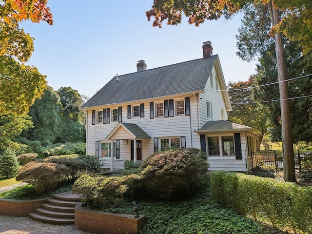 537 Moriches Rd, Head Of The Harbor, NY 11780 - colonial inspired home with a chimney and roof with shingles