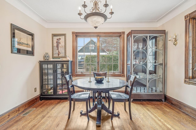 537 Moriches Rd, Head Of The Harbor, NY 11780 - dining space with wood finished floors and a chandelier