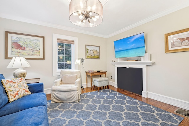 537 Moriches Rd, Head Of The Harbor, NY 11780 - living area featuring a chandelier, wood finished floors, and crown molding