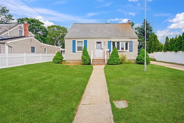 6 Vermont St, Lindenhurst, NY 11757 - view of front of home featuring roof with shingles and a chimney