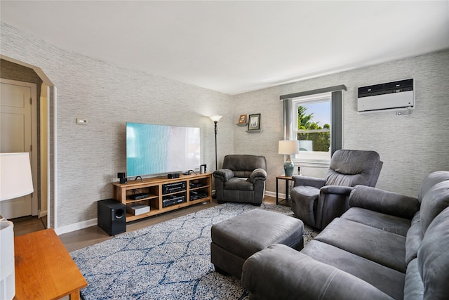 6 Vermont St, Lindenhurst, NY 11757 - living area with wood finished floors, a wall mounted AC, and arched walkways