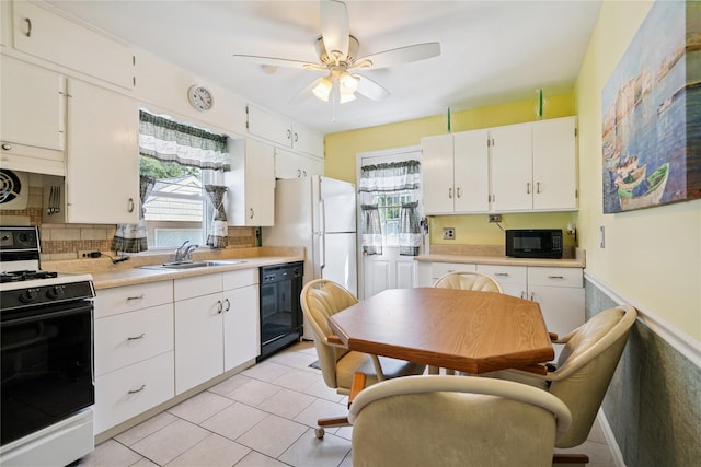 6 Vermont St, Lindenhurst, NY 11757 - kitchen featuring black appliances, a ceiling fan, light countertops, white cabinets, and decorative backsplash
