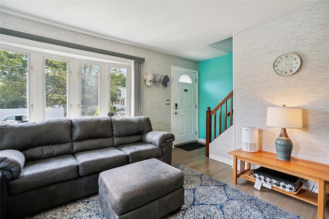 6 Vermont St, Lindenhurst, NY 11757 - living room with wood finished floors, wallpapered walls, and stairway