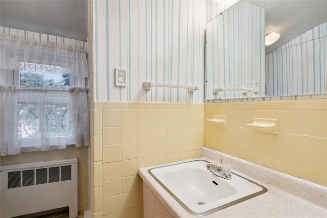 6 Vermont St, Lindenhurst, NY 11757 - bathroom with radiator heating unit, wallpapered walls, tile walls, and wainscoting