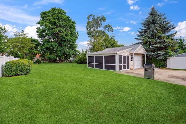 6 Vermont St, Lindenhurst, NY 11757 - view of yard featuring a sunroom, driveway, a garage, and an outdoor structure