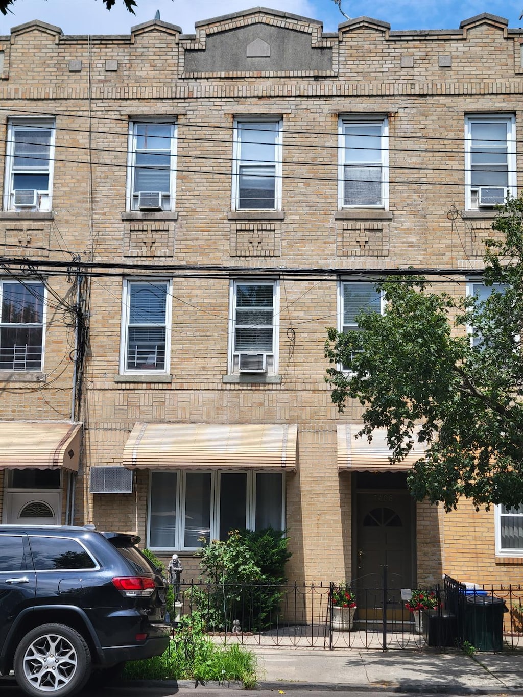 7408 15th Ave, Brooklyn, NY 11228 - view of front of home with cooling unit and brick siding
