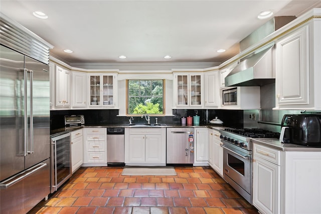 10 Laurel Woods Dr, Upper Brookville, NY 11771 - kitchen with built in appliances, wine cooler, tasteful backsplash, glass insert cabinets, and recessed lighting