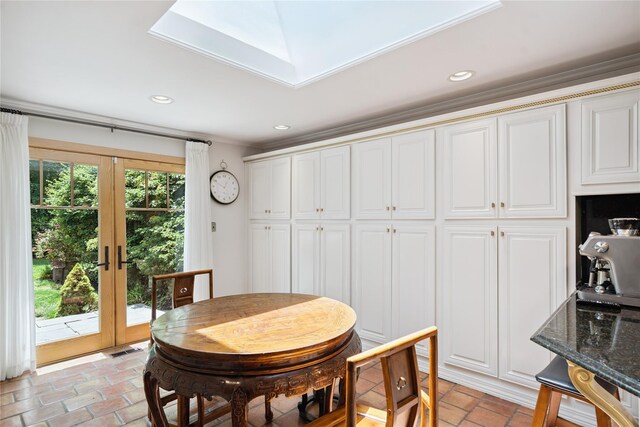 10 Laurel Woods Dr, Upper Brookville, NY 11771 - dining space with brick flooring, french doors, crown molding, and recessed lighting