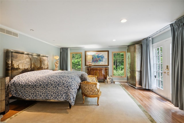 10 Laurel Woods Dr, Upper Brookville, NY 11771 - bedroom featuring multiple windows, crown molding, wood finished floors, access to exterior, and recessed lighting