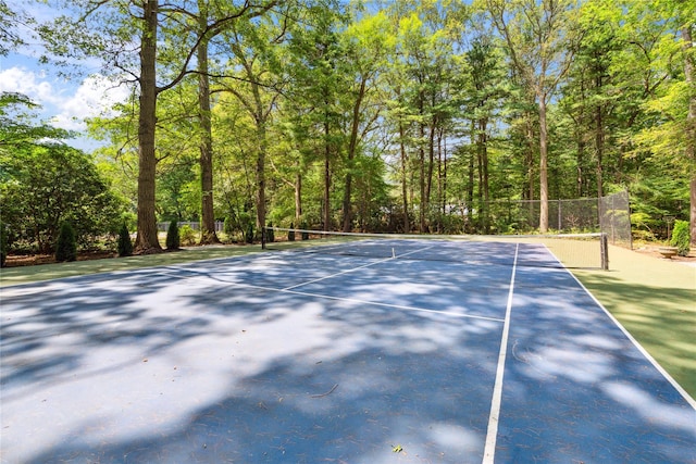 10 Laurel Woods Dr, Upper Brookville, NY 11771 - view of tennis court featuring a forest view