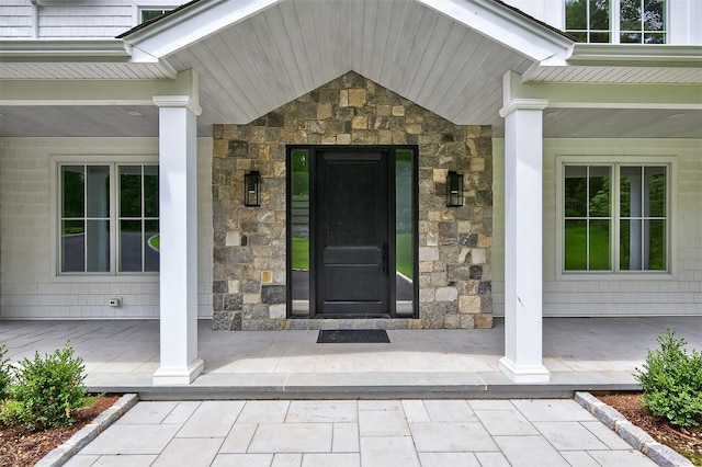32A Pine Rd, Syosset, NY 11791 - view of exterior entry featuring stone siding and a porch