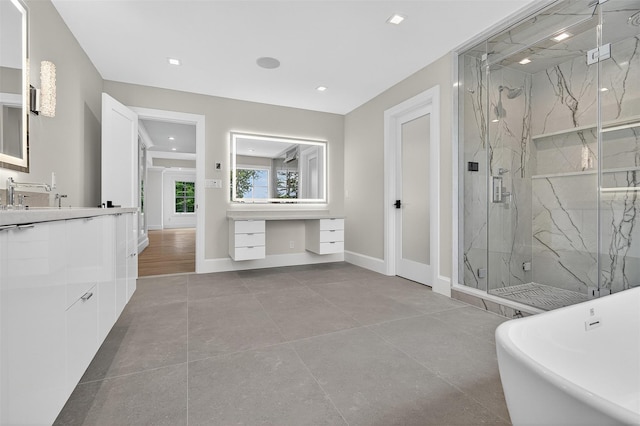 32A Pine Rd, Syosset, NY 11791 - bathroom featuring a marble finish shower, vanity, a soaking tub, and recessed lighting