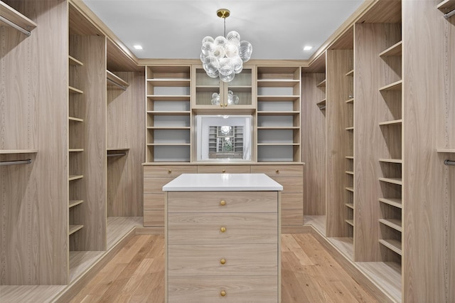 32A Pine Rd, Syosset, NY 11791 - spacious closet featuring a chandelier and light wood-style floors