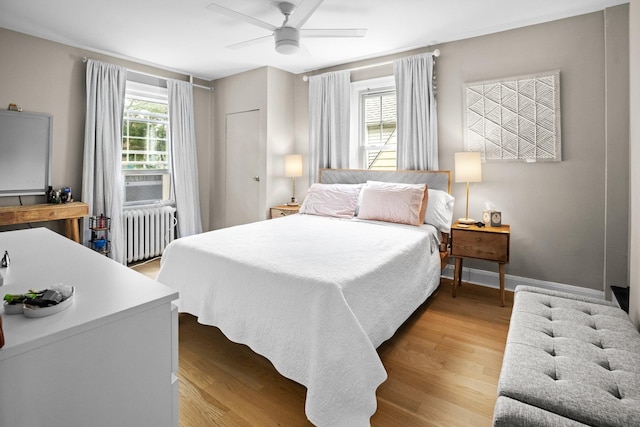 51 Lincoln St, New Rochelle, NY 10801 - bedroom featuring radiator, light wood-type flooring, and a ceiling fan