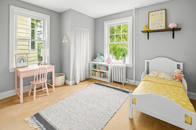 51 Lincoln St, New Rochelle, NY 10801 - bedroom featuring radiator heating unit and wood finished floors