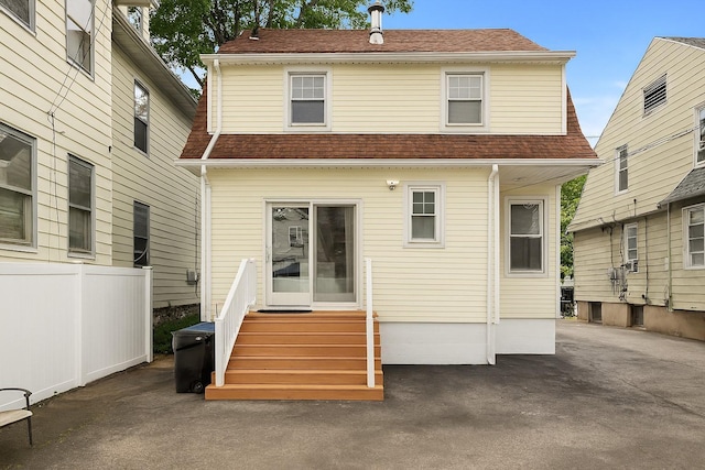 51 Lincoln St, New Rochelle, NY 10801 - rear view of house featuring entry steps and a shingled roof