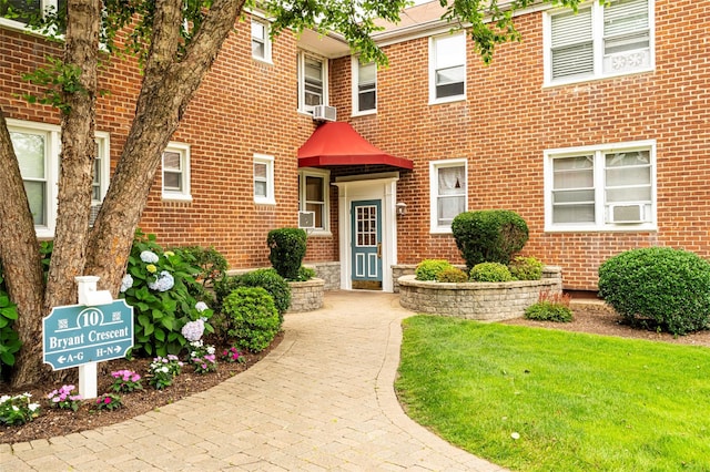 10 Bryant Cres Unit 1J, White Plains, NY 10605 - view of front of house with brick siding and cooling unit