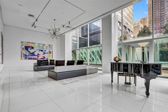 635 W 42nd St Unit 7A, New York Manhattan, NY 10036 - building lobby featuring expansive windows, a towering ceiling, and a view of city