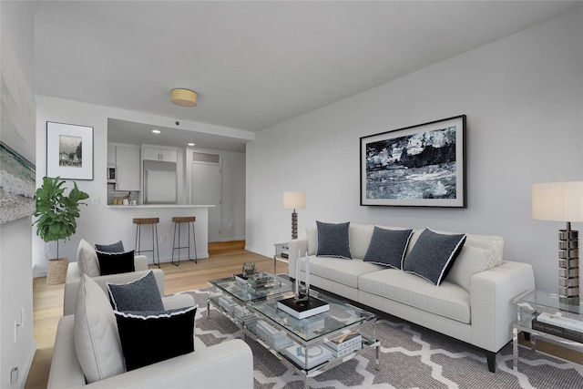 635 W 42nd St Unit 7A, New York Manhattan, NY 10036 - living area featuring light wood-style floors and recessed lighting