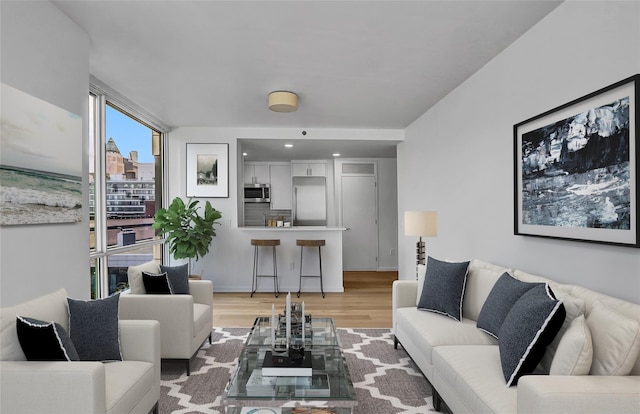 635 W 42nd St Unit 7A, New York Manhattan, NY 10036 - living area featuring light wood-type flooring