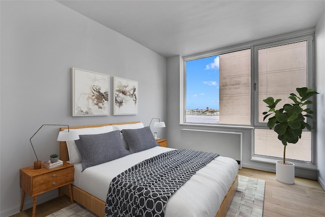 635 W 42nd St Unit 7A, New York Manhattan, NY 10036 - bedroom featuring wood finished floors