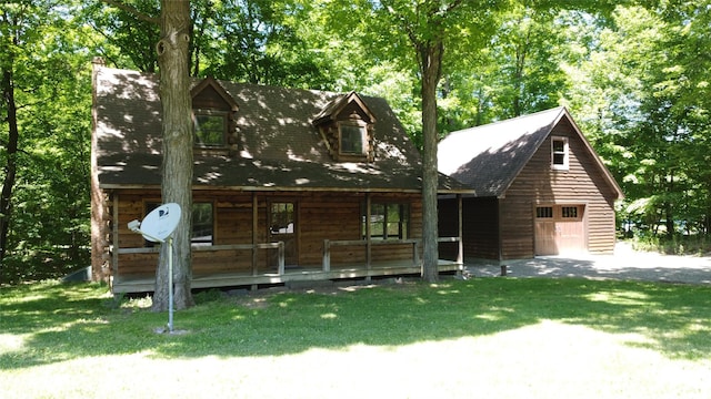 5 Will Palmer Rd, Catskill, NY 12414 - log home with covered porch, a front lawn, and a detached garage