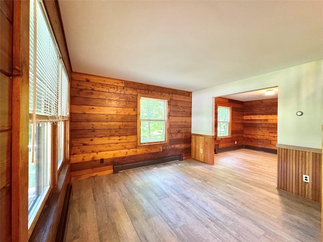 5 Will Palmer Rd, Catskill, NY 12414 - unfurnished room with wood walls, a baseboard radiator, wood finished floors, and a wainscoted wall