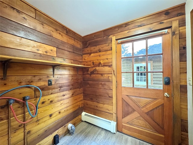 5 Will Palmer Rd, Catskill, NY 12414 - doorway featuring baseboard heating, wood walls, and wood finished floors