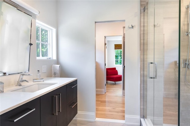 11 Lawrence Ln, Palisades, NY 10964 - full bath featuring vanity, a shower stall, plenty of natural light, and wood finished floors
