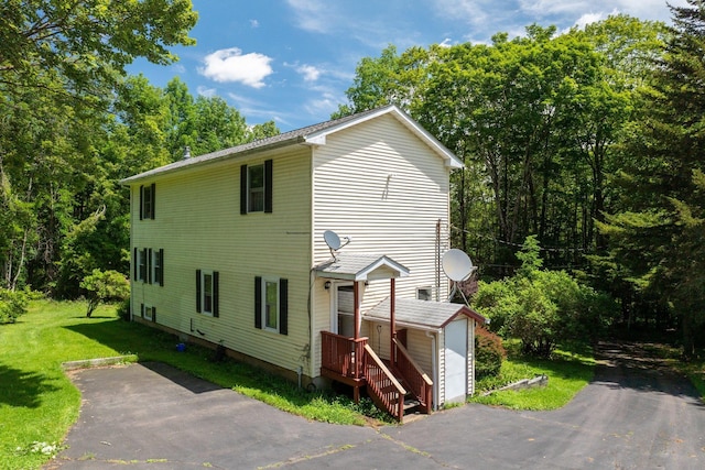 TR34 10 Hoffman Rd, Fremont Center, NY 12736 - view of front facade with a storage unit and a front lawn