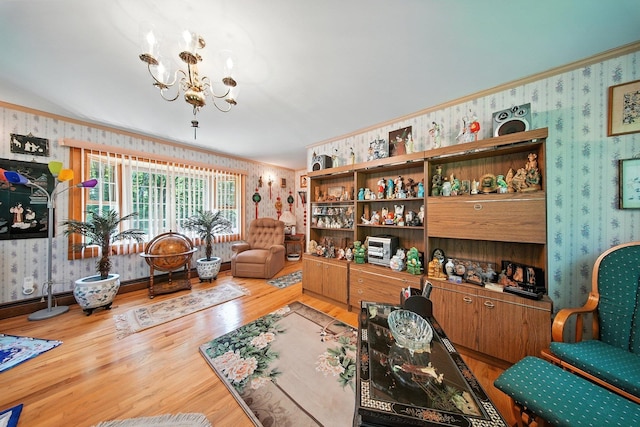 TR34 10 Hoffman Rd, Fremont Center, NY 12736 - living area with wallpapered walls, a chandelier, wood finished floors, and ornamental molding