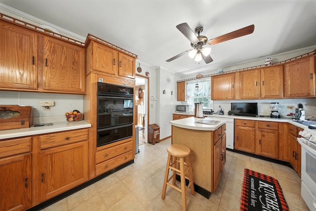 TR34 10 Hoffman Rd, Fremont Center, NY 12736 - kitchen with white appliances, a warming drawer, crown molding, and brown cabinets