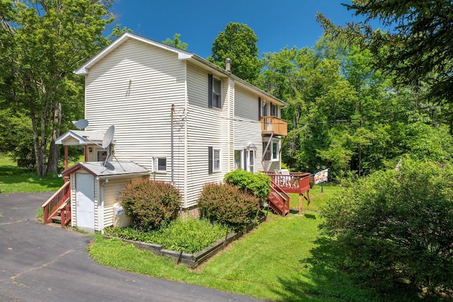 TR34 10 Hoffman Rd, Fremont Center, NY 12736 - view of property exterior with a balcony, a lawn, stairs, and a wooden deck
