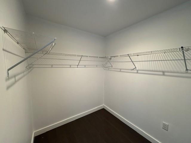 13105 40th Rd Unit 15E, Flushing, NY 11354 - walk in closet with dark wood-style flooring