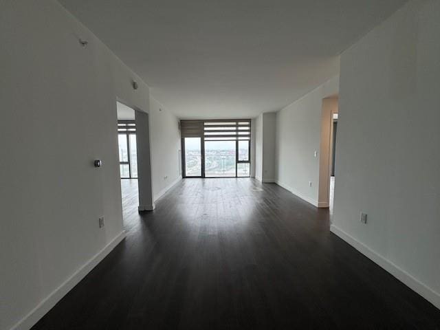 13105 40th Rd Unit 15E, Flushing, NY 11354 - unfurnished room featuring dark wood finished floors and baseboards