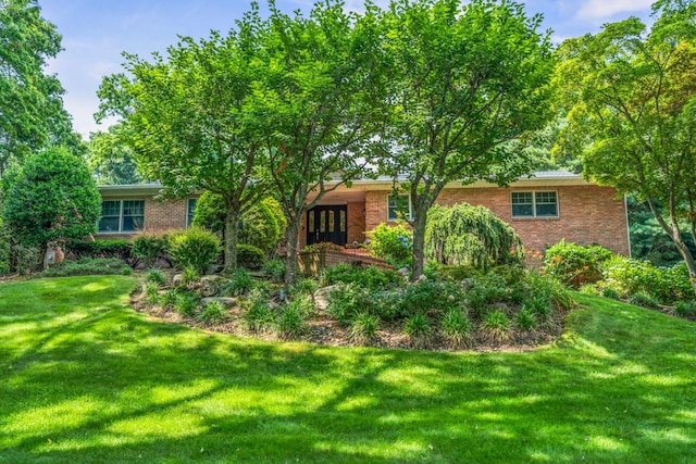 14 Etna Ln, Dix Hills, NY 11746 - back of house with brick siding and a lawn