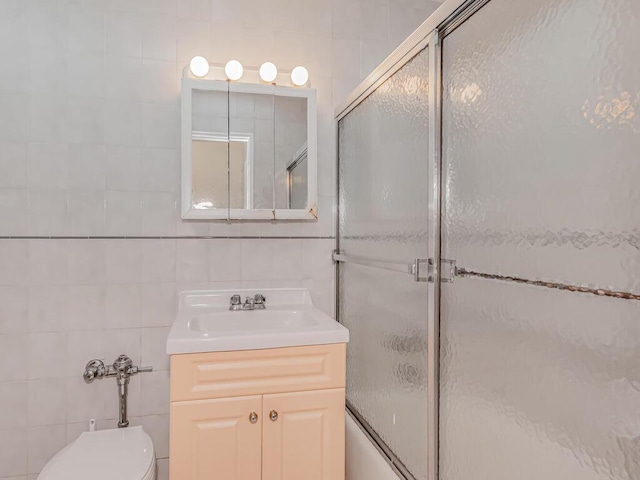 679 W 239th St W Unit 3J, Bronx, NY 10463 - full bathroom featuring tile walls, vanity, and shower / bath combination with glass door