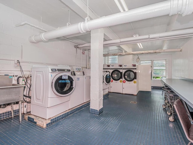 679 W 239th St W Unit 3J, Bronx, NY 10463 - community laundry with washing machine and dryer and tile patterned floors